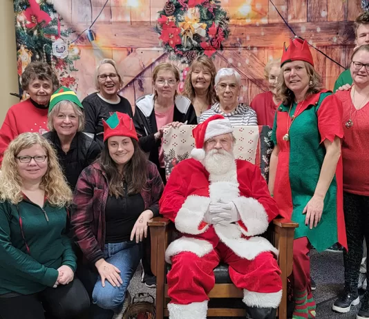 Santa cruises into Woodville on a big red firetruck