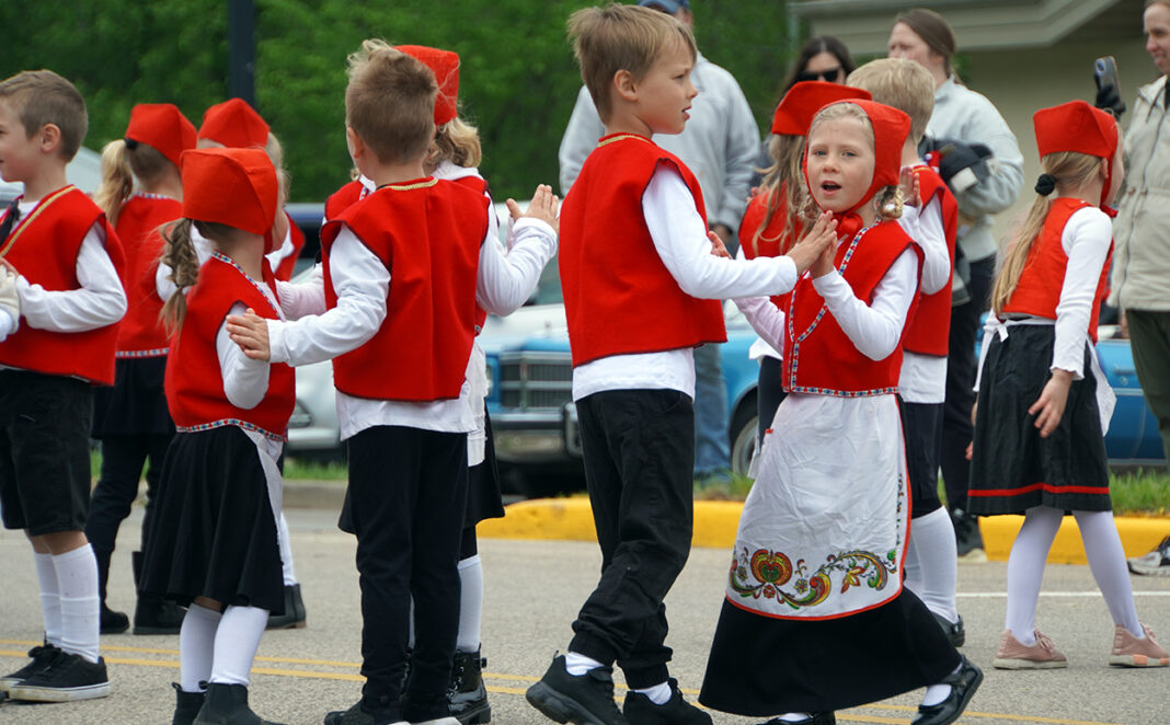 001THU-DSC04617-POW-B-W-Kindergartners-dancing-in-the-74th-Annual-Syttende-Mai-Parade.-Photo-by-Paul-J.-Seeling(W)